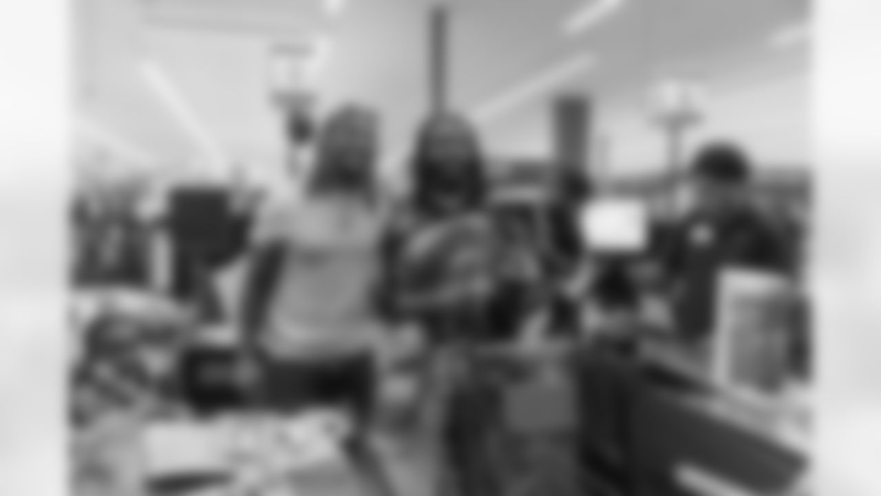 New Orleans Saints safety Justin Reid hosted his annual "Justin's Thanksgiving Grocery Grab" shopping spree for local shoppers on Nov. 24, 2025. Saints safety Terrell Burgess assisted their teammate during the event.