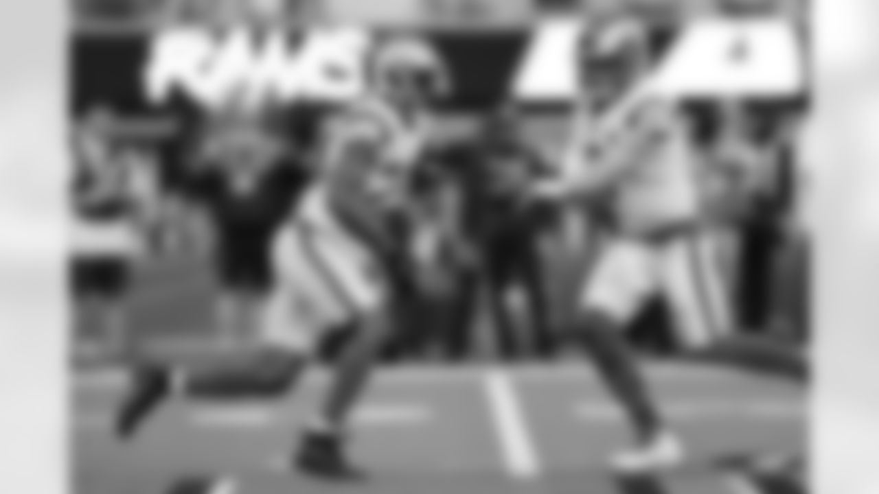 Los Angeles Rams quarterback Matthew Stafford (9) hands the ball off to running back Cam Akers (23) during the NFL Super Bowl 56 football game against the Cincinnati Bengals, Sunday, Feb. 13, 2022, in Inglewood, Calif. The Los Angeles Rams won 23-20.
