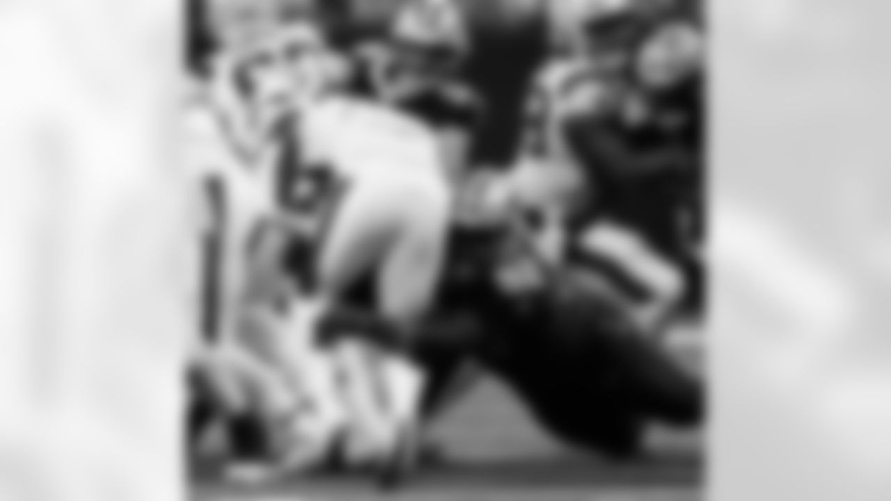 DT Davon Godchaux (92) makes a tackle during the New Orleans Saints game against the New England Patriots for Week 6 of the 2025 NFL season on October 12, 2025 at Caesars Superdome.