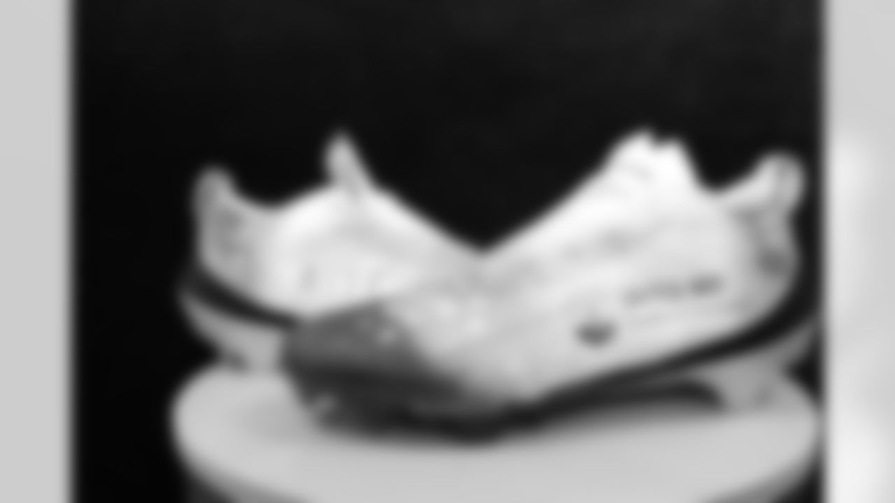 Get a preview as New Orleans Saints owner Gayle Benson, players and coaches honor their personal causes and foundations for the 2025 NFL My Cause My Cleats initiative during their Week 12 game against the Atlanta Falcons.
Spencer Rattler: United Way of Southeast LA | Artist: Christina Pappion