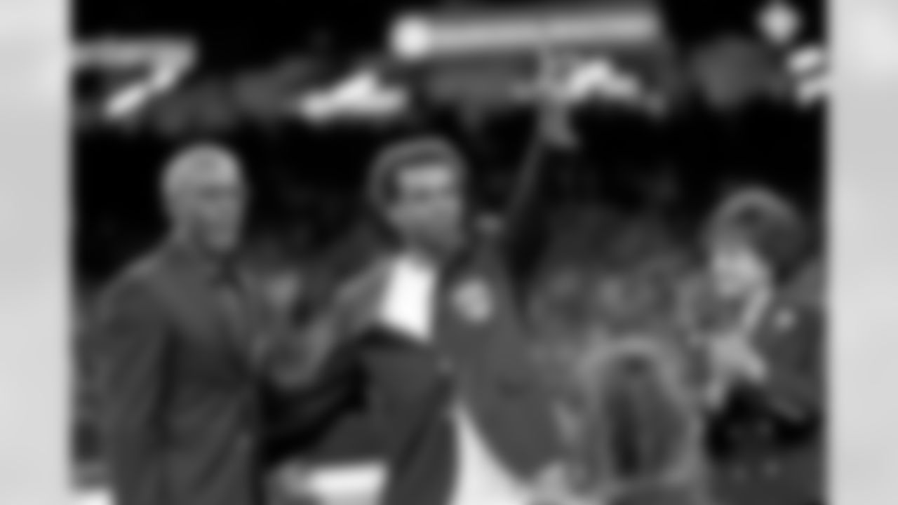 New Orleans Saints owner Gayle Benson presents Brett Maxie and Tracy Porter with their Saints Hall of Fame jackets during a ceremony on the field before the game against the Carolina Panthers on Sunday, Dec. 14, 2025 in New Orleans. (Michael DeMocker/ NFL LCC)