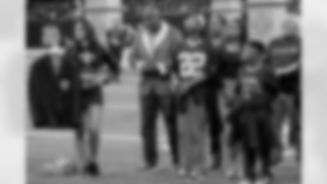 New Orleans Saints owner Gayle Benson presents Brett Maxie and Tracy Porter with their Saints Hall of Fame jackets during a ceremony on the field before the game against the Carolina Panthers on Sunday, Dec. 14, 2025 in New Orleans. (Michael DeMocker/ NFL LCC)