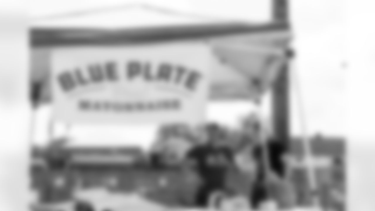Staff members for the New Orleans Saints and Blue Plate Mayonnaise participated in the 2025 Build and Boil put on by Rebuilding Together New Orleans on Saturday, May 17, 2025. Volunteers participated in home repairs and then enjoyed a crawfish boil.