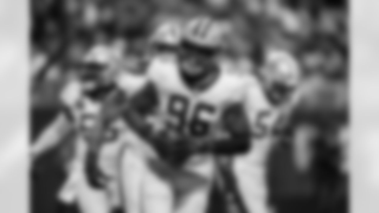 New Orleans Saints defensive end Carl Granderson (96) celebrates an interception during the first half of an NFL football game against the Atlanta Falcons, Sunday, Jan. 4, 2026, in Atlanta.