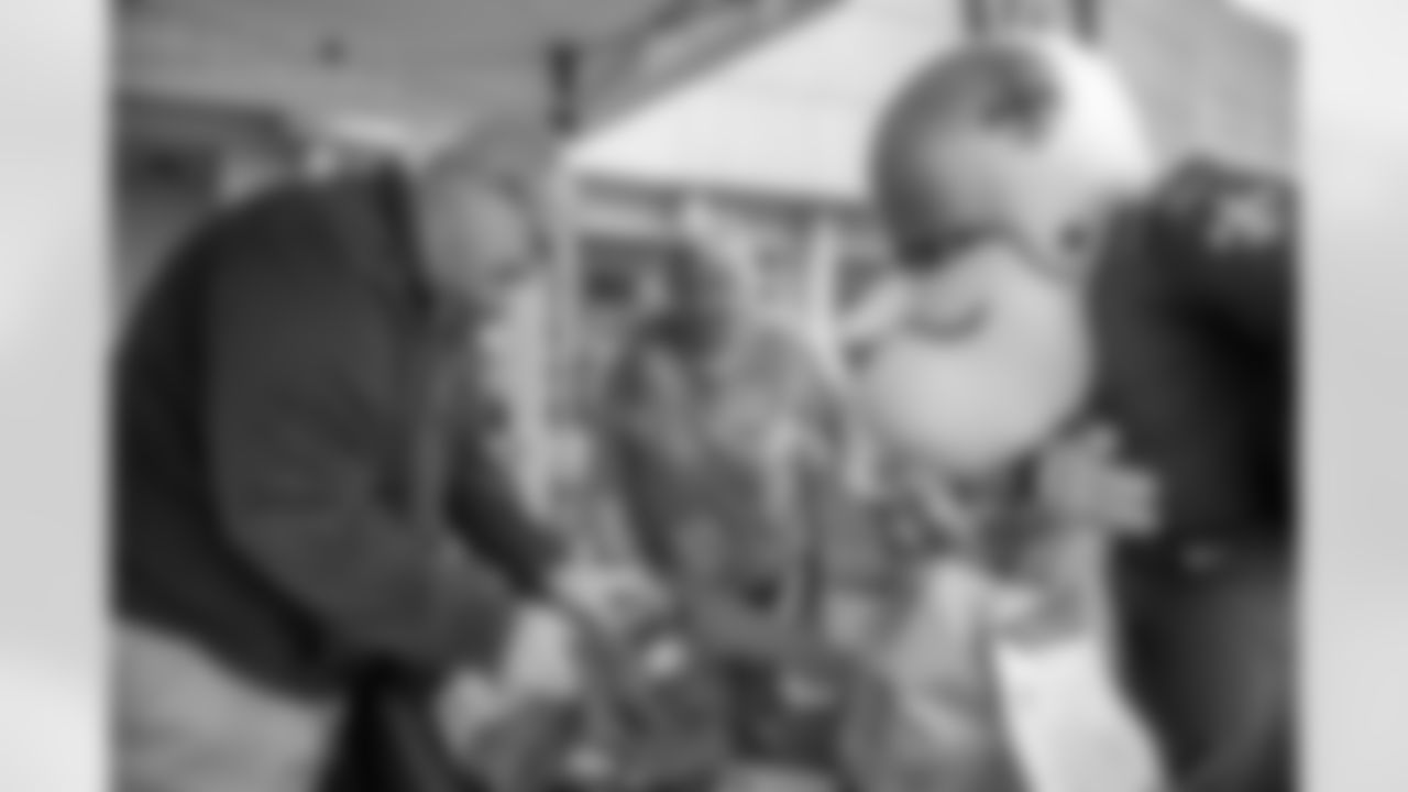 Saints legend Chris Reis appeared at the latest food drive to benefit food banks across the Gulf Coast hosted by the New Orleans Saints and Rouses Markets in Lafayette, LA on Friday, Dec. 1 along with Saints Cheer Krewe members and Sir Saint.