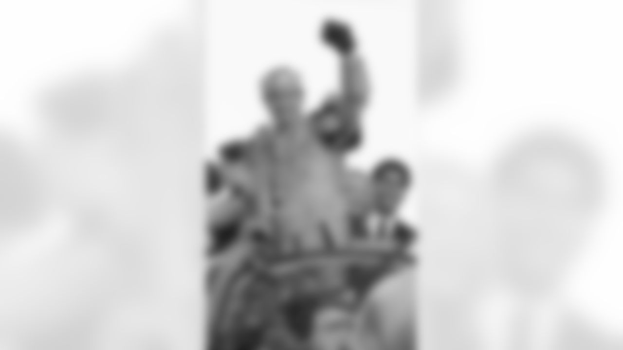 New Orleans Saints quarterback Drew Brees acknowledges the crowd as he rides on a float in the Bacchus Mardi Gras parade in New Orleans, Sunday, Feb 14, 2010. The Saints beat the Indianapolis Colts in the Super Bowl the previous Sunday.