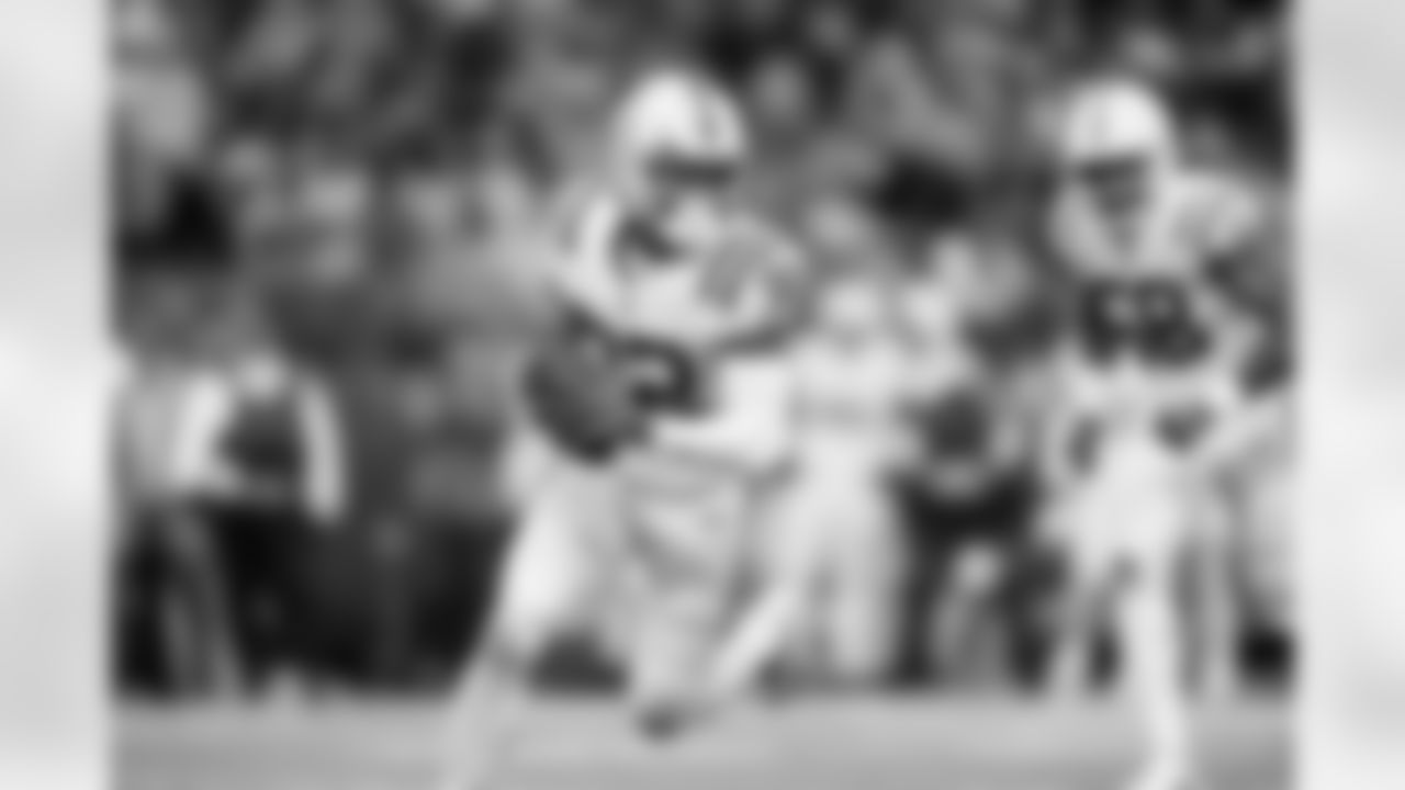 Indianapolis Colts safety Julian Blackmon (32) runs back an interception to score a touchdown during an NFL football game against the Minnesota Vikings, Saturday, Dec. 17, 2022, in Minneapolis.
