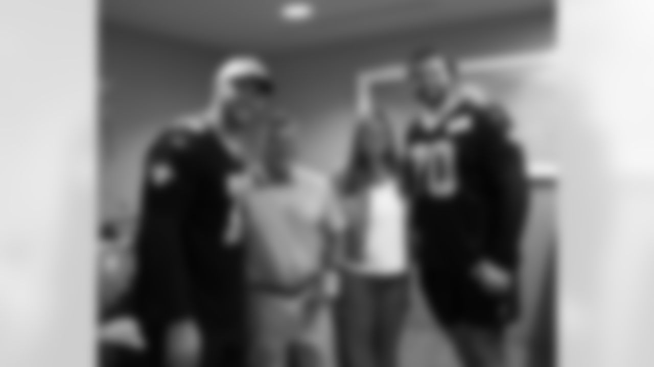 New Orleans Saints players Trevor Penning and Luke Fortner surprised patients and their families at the Gayle and Tom Benson Cancer Center on October 7, 2025 as part of the NFL's Crucial Catch month.