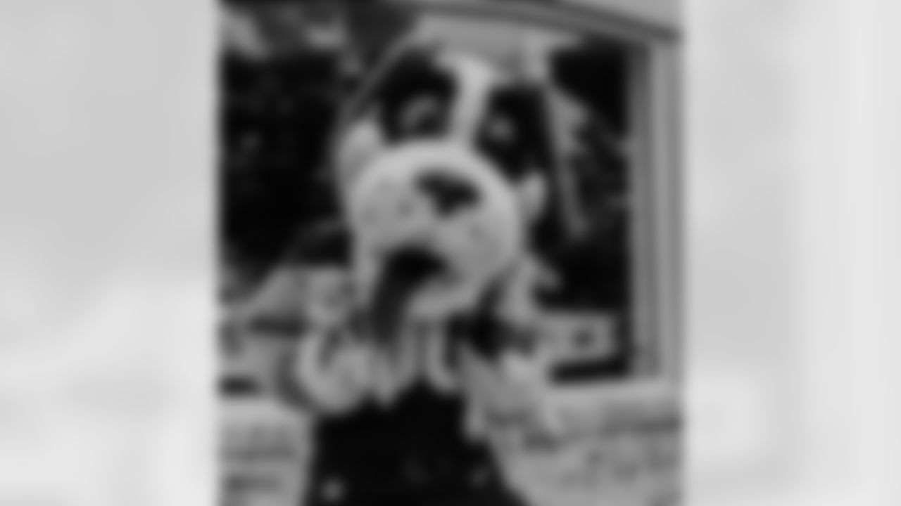 New Orleans Saints tight end Juwan Johnson and his wife Chanen joined Take Paws Rescue for a pet adoption event at the Raising Cane's on Veterans Boulevard on Tuesday, November 21, 2023.