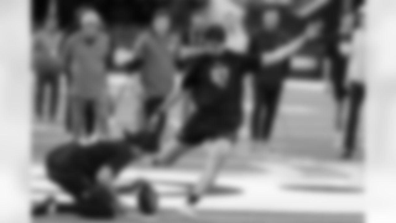 Michigan kicker Dominic Zvada (07) kicks at the NFL football scouting combine in Indianapolis, Wednesday, Feb. 25, 2026.