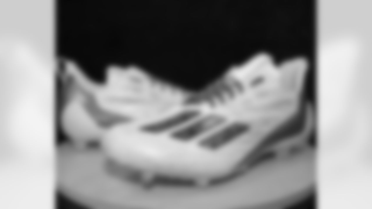 Get a preview as New Orleans Saints owner Gayle Benson, players and coaches honor their personal causes and foundations for the 2025 NFL My Cause My Cleats initiative during their Week 12 game against the Atlanta Falcons.
Taysom Hill: Hope for Fertility | Artist: Sandi DeMeo