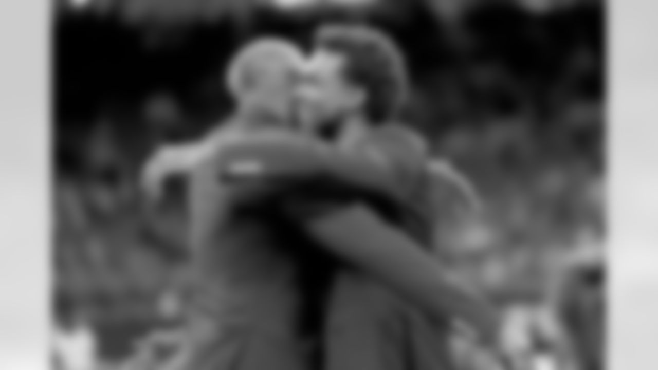 New Orleans Saints owner Gayle Benson presents Brett Maxie and Tracy Porter with their Saints Hall of Fame jackets during a ceremony on the field before the game against the Carolina Panthers on Sunday, Dec. 14, 2025 in New Orleans. (Michael DeMocker/ NFL LCC)