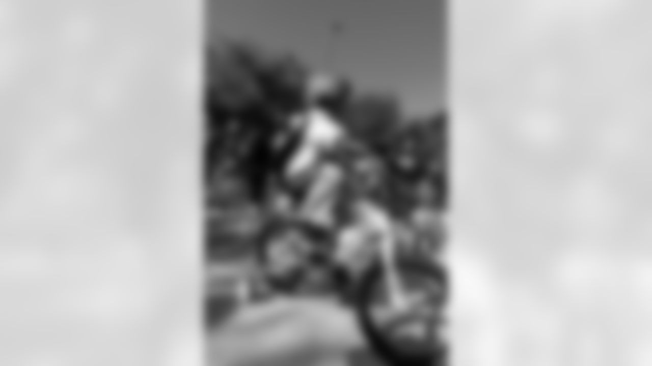 New Orleans Saints quarterback Tyler Shough and defensive end Cam Jordan joined Raising Cane's to surprise 100 kids from the Boys and Girls Club of Metro Louisiana with new bikes and helmets for the holidays on Tuesday, Dec. 9, 2025.