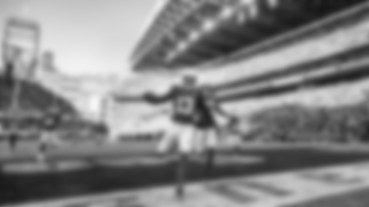 Seahawks linebacker Ernest Jones IV celebrates after the first pick-six of his pro career on a 85-yard interception return for touchdown.