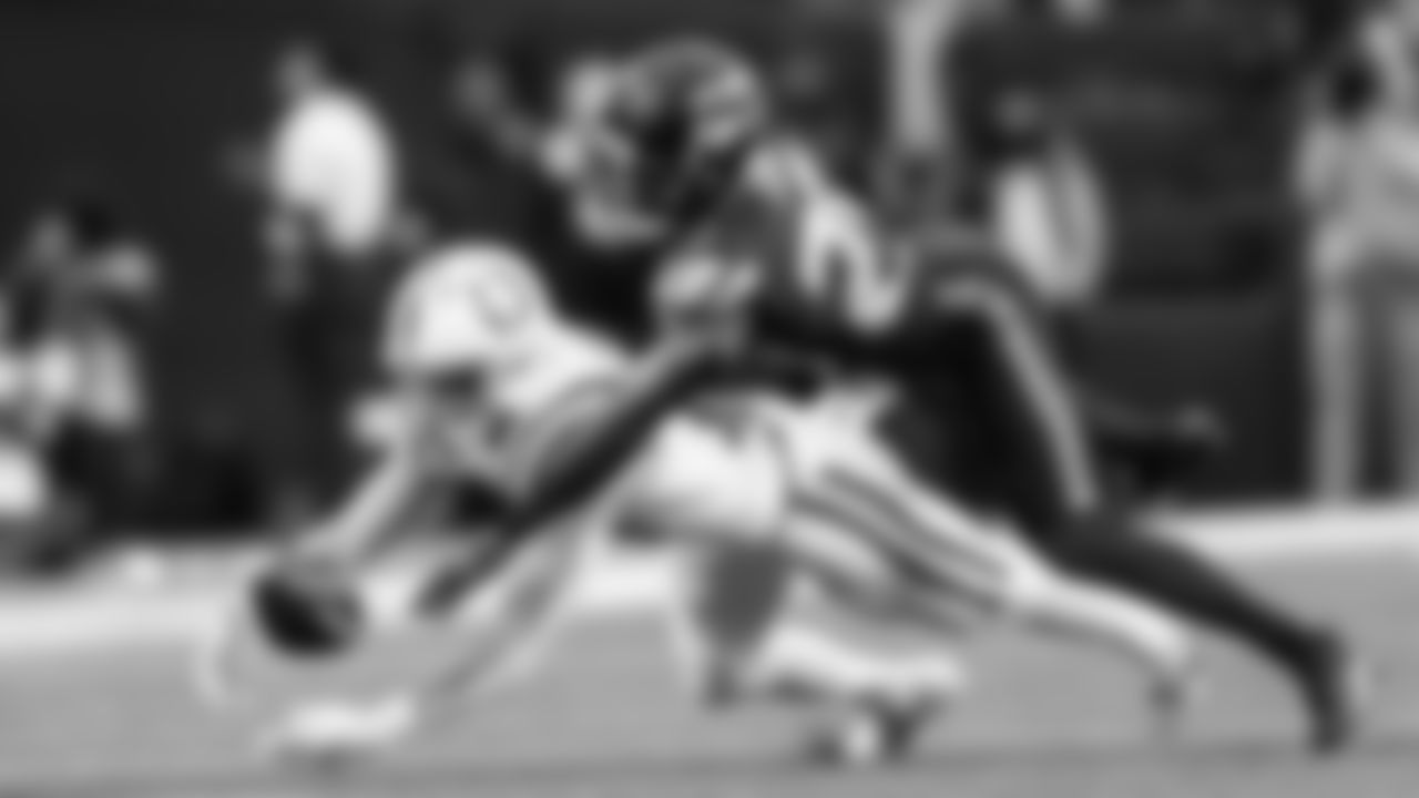 Seahawks cornerback Josh Jobe bats the ball away from a Colts receiver.