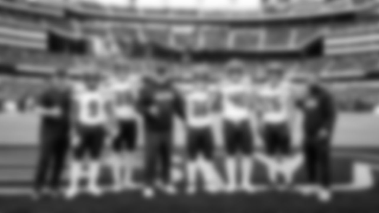 Seahawks running backs and coaches pose for a group photo before the game.