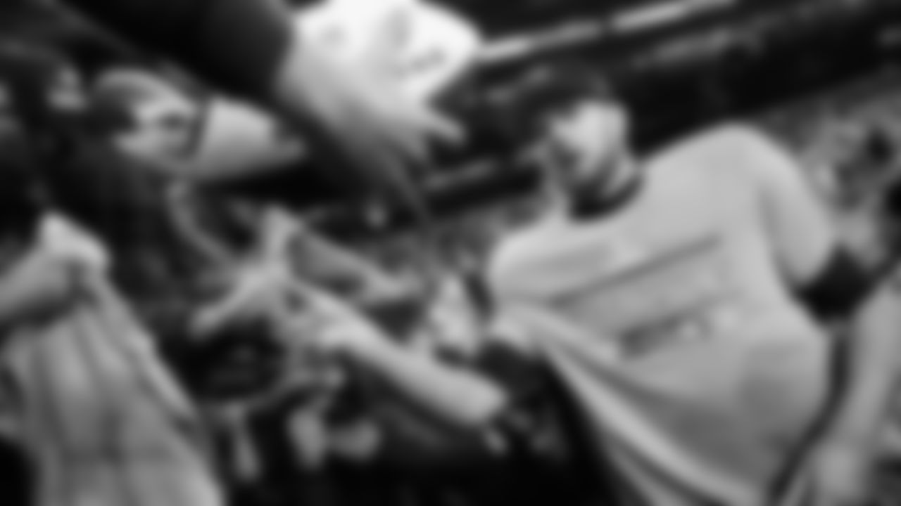 Seattle Seahawks quarterback Sam Darnold, right, celebrates with fans after the NFC Championship NFL football game against the Los Angeles Rams, Sunday, Jan. 25, 2026, in Seattle. (AP Photo/Godofredo A. Vásquez)