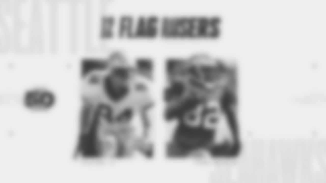 Seahawks Legends Chad Brown and Darrell Jackson raise the flag before the Week 16 Rivalries matchup against the Rams on December 18th, 2025