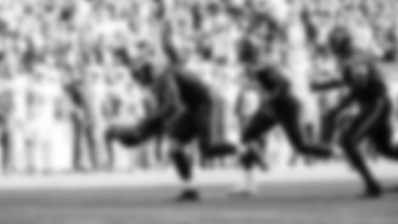 Seahawks linebacker Tyrice Knight (48) sacks Cardinals QB Jacoby Brissett and defensive end DeMarcus Lawrence (0) scoops the ball up and scores the touchdown.