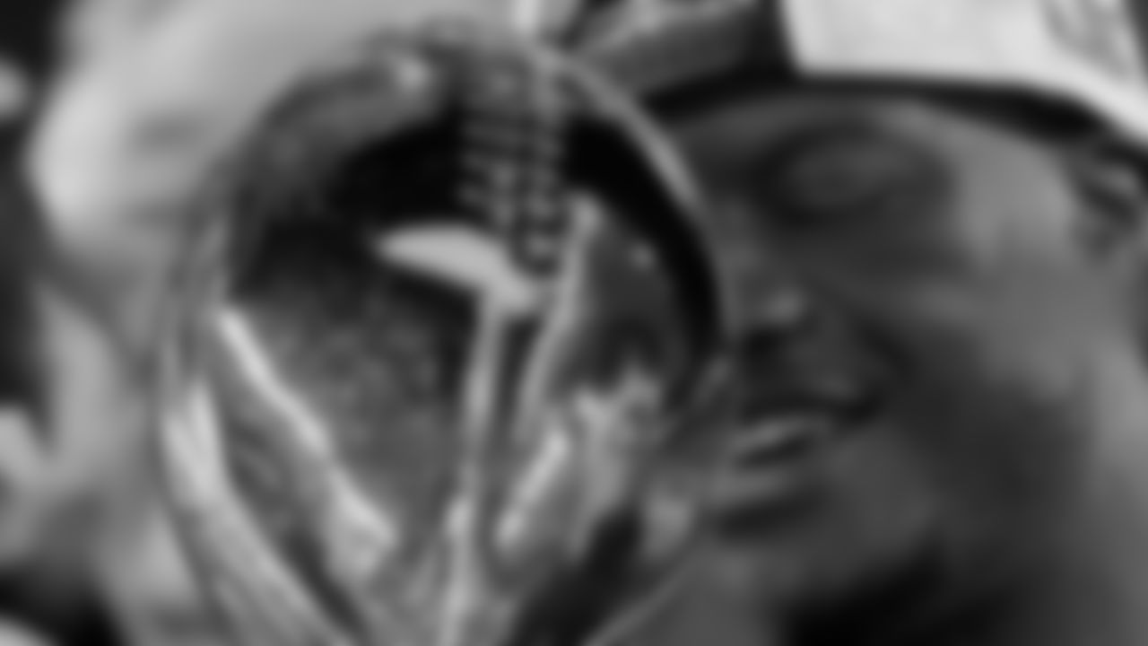 Seattle Seahawks head coach Mike MacDonald is reflected in the Lombardi Trophy after a win over the New England Patriots in the NFL Super Bowl 60 football game Sunday, Feb. 8, 2026, in Santa Clara, Calif. (AP Photo/Matt Slocum)