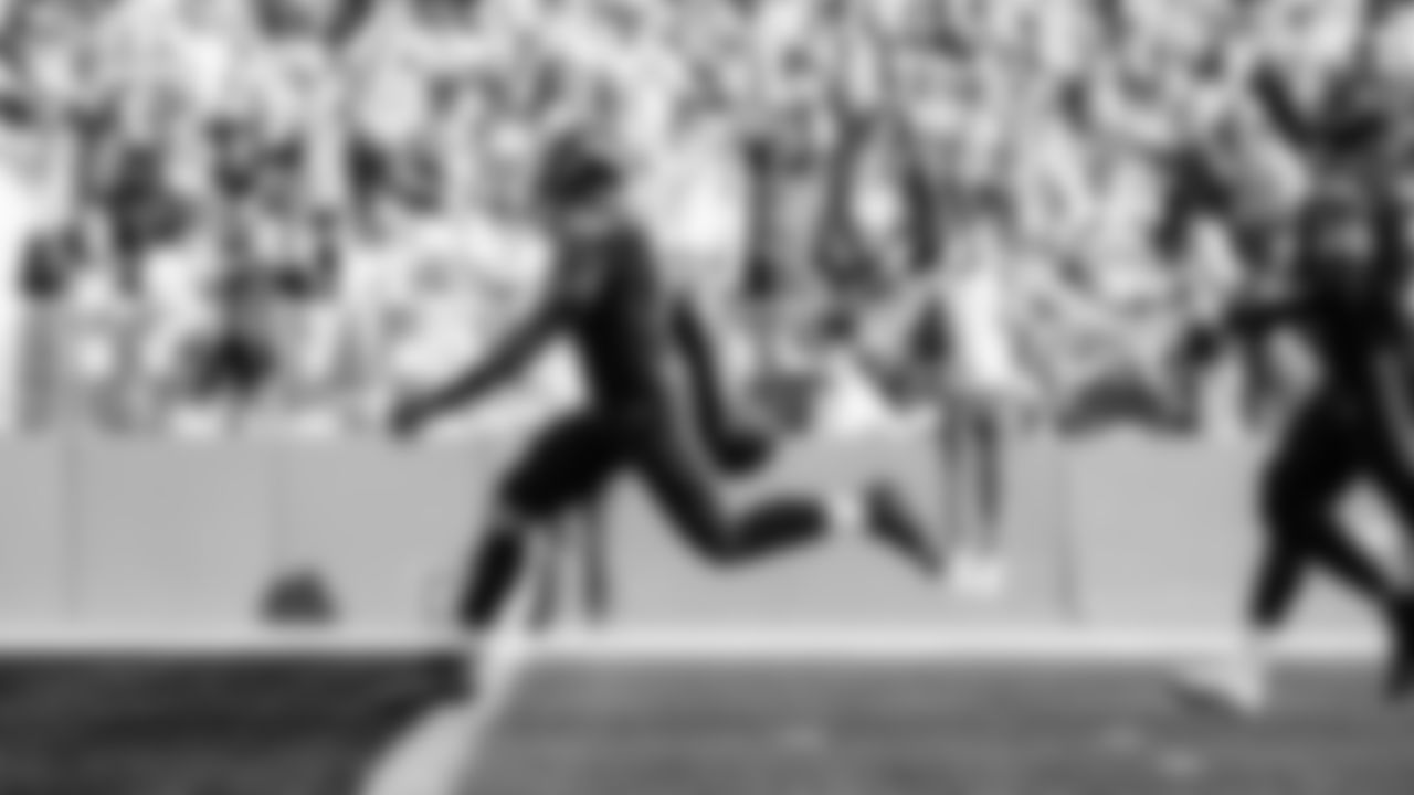 Seahawks linebacker Tyrice Knight (48) sacks Cardinals QB Jacoby Brissett and defensive end DeMarcus Lawrence (0) scoops the ball up and scores the touchdown.