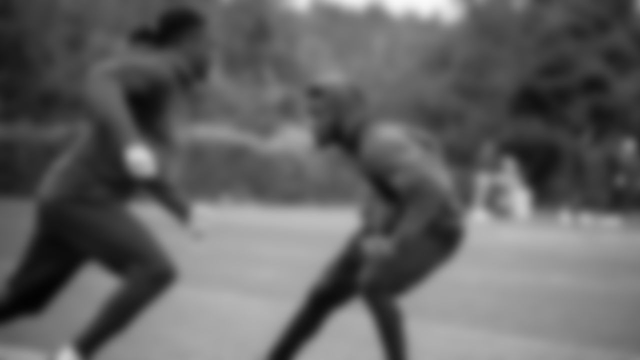 Seahawks cornerback Devon Witherspoon (21) and cornerback Riq Woolen (27) participated in a workout on May 21, 2025 at the Virginia Mason Athletic Center.