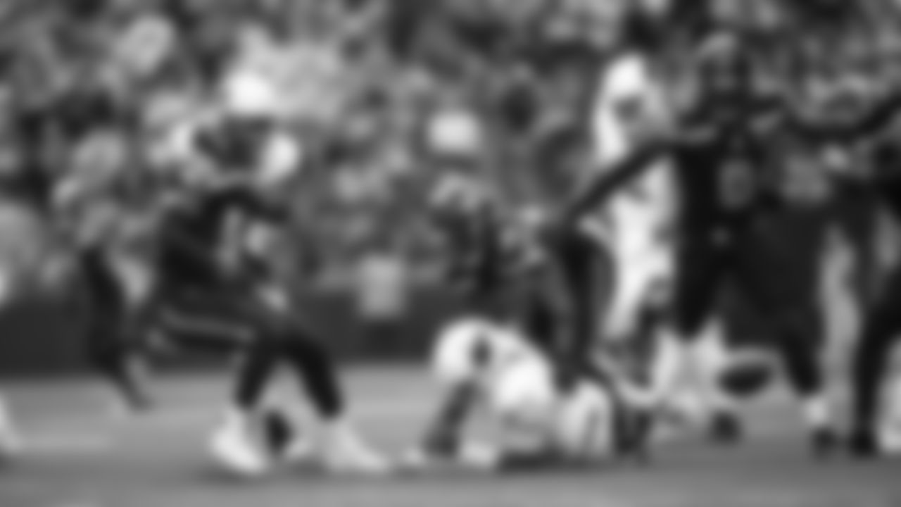 Seahawks linebacker Tyrice Knight (48) sacks Cardinals QB Jacoby Brissett and defensive end DeMarcus Lawrence (0) scoops the ball up and scores the touchdown.