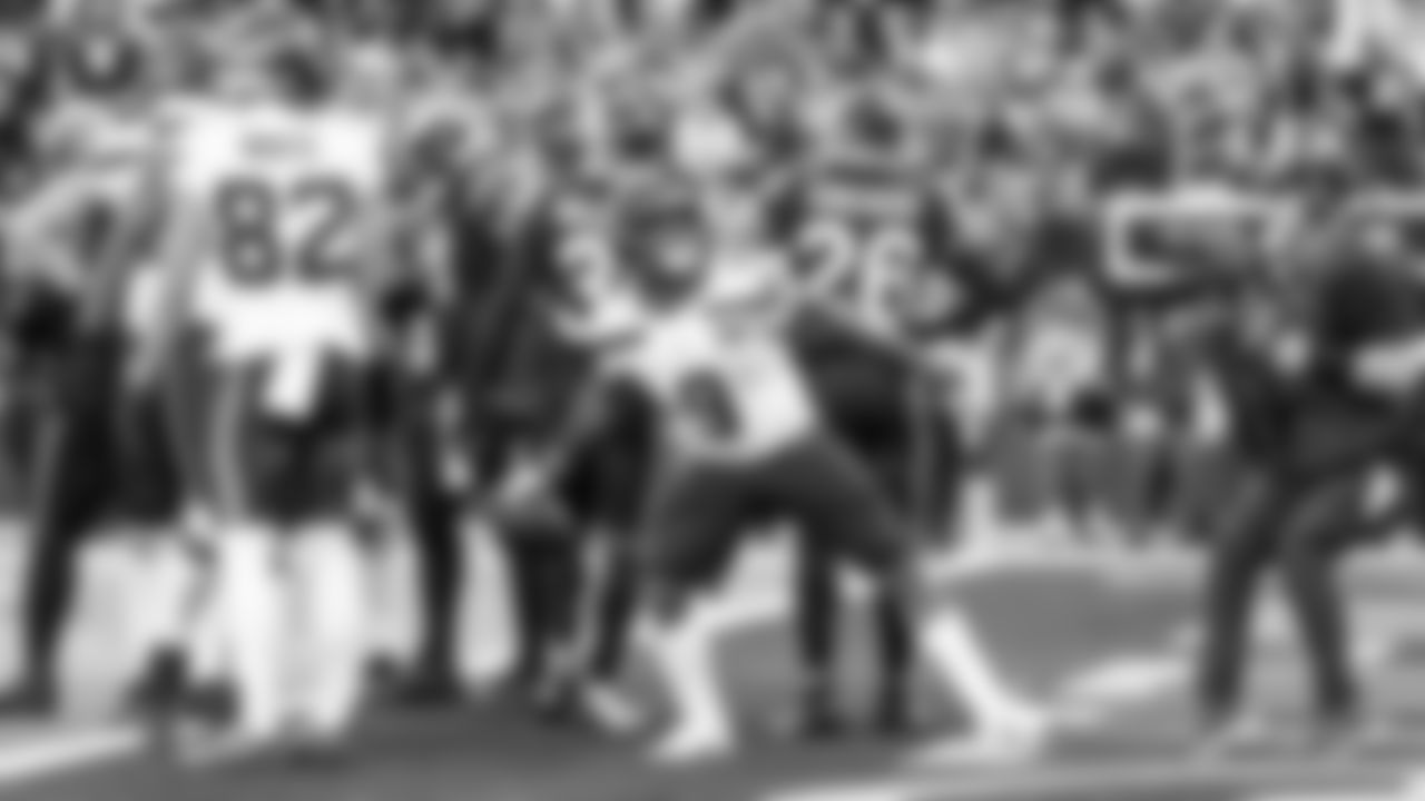 Seahawks running back Kenneth Walker III throws the ball into the crowd after scoring a touchdown in the fourth quarter.