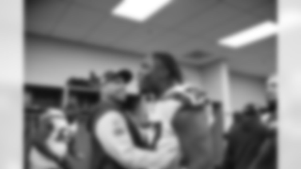 Seahawks defensive coordinator Aden Durde and tackle Charles Cross (67) celebrate the Week 14 win over the Arizona Cardinals on Sunday, December 8, 2024 at State Farm Stadium in Glendale, Arizona.