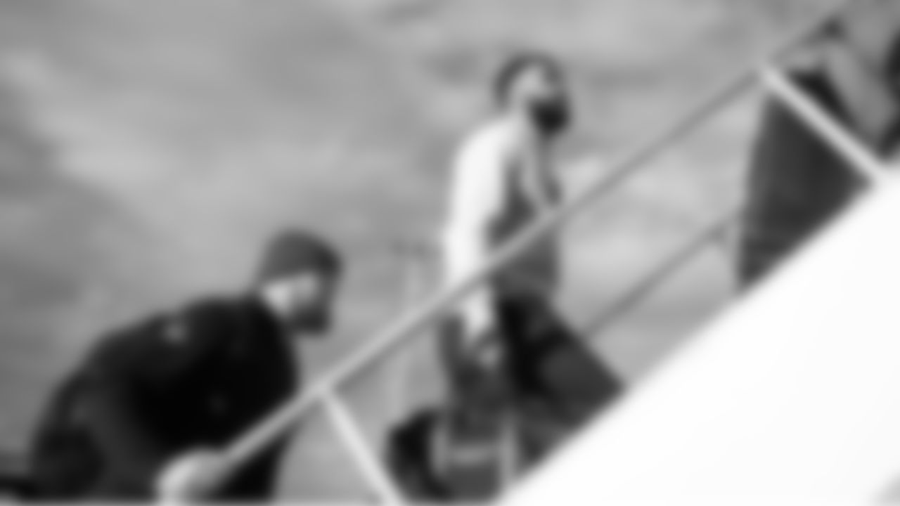 Under sunny skies, Julian Love, Bryce Cabeldue and the rest of the team boarded the charter flight to Charlotte.