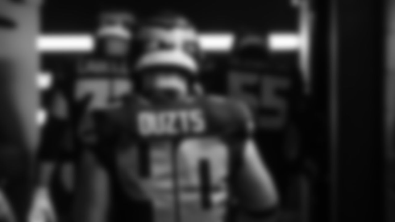 Seahawks fullback Robbie Ouzts (40) walks through the Emerald Queen Casino tunnel club at Lumen Field for the Week 10 matchup vs. the Cardinals.