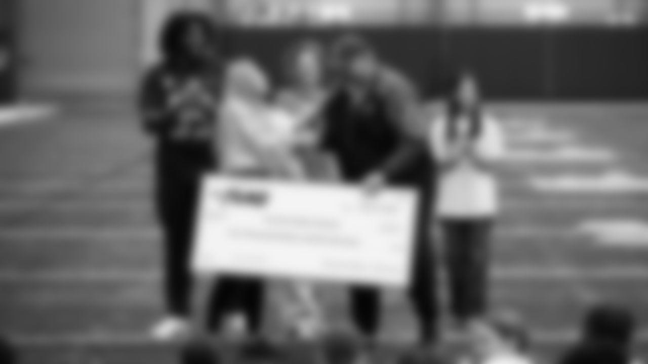 The Seahawks Women's Association packed girls flag kits and hosted a free girls flag football camp at the Seahawks training facility on Saturday, November 8, 2025.