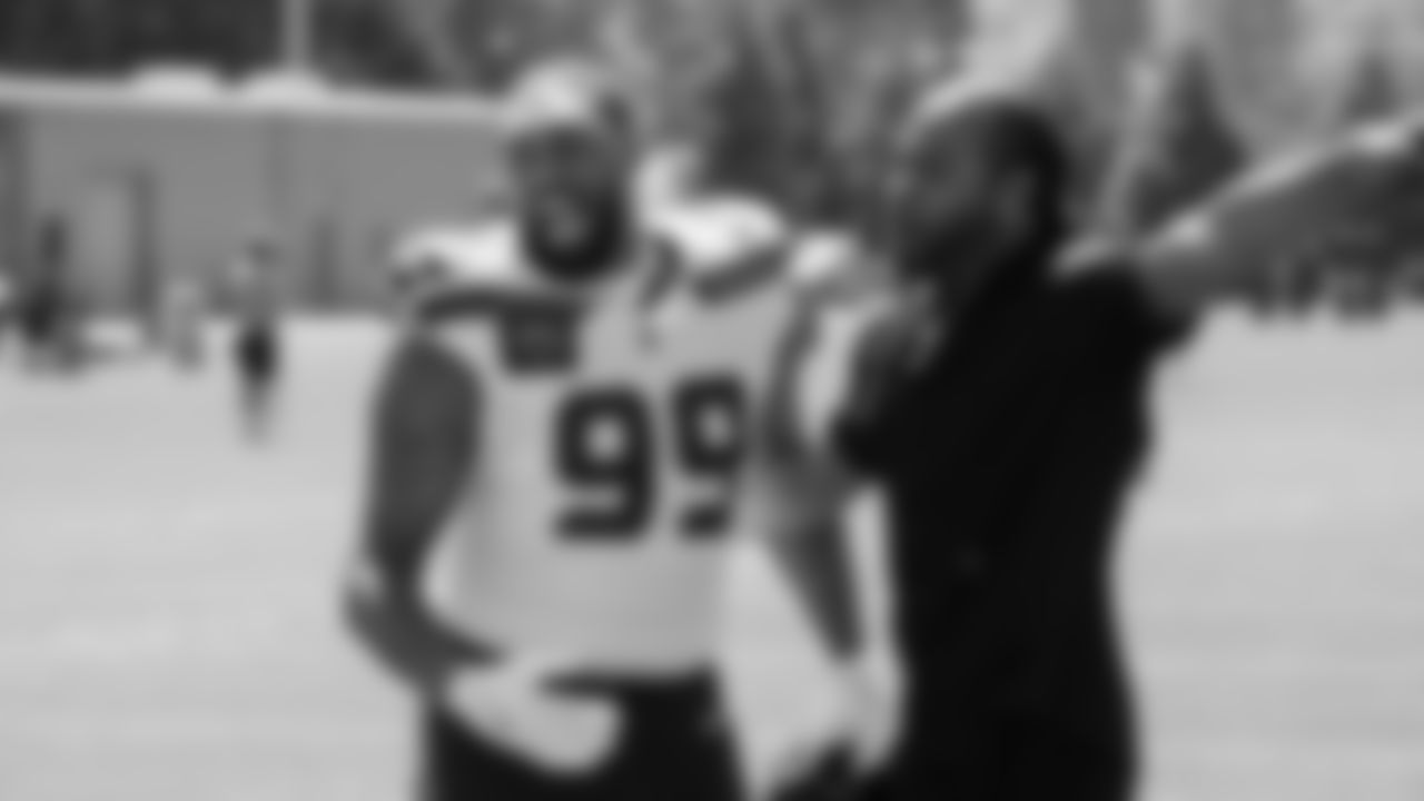 Seahawks Legend Richard Sherman with defensive end Leonard Williams (99) at practice on August 12, 2025 at the Virginia Mason Athletic Center.