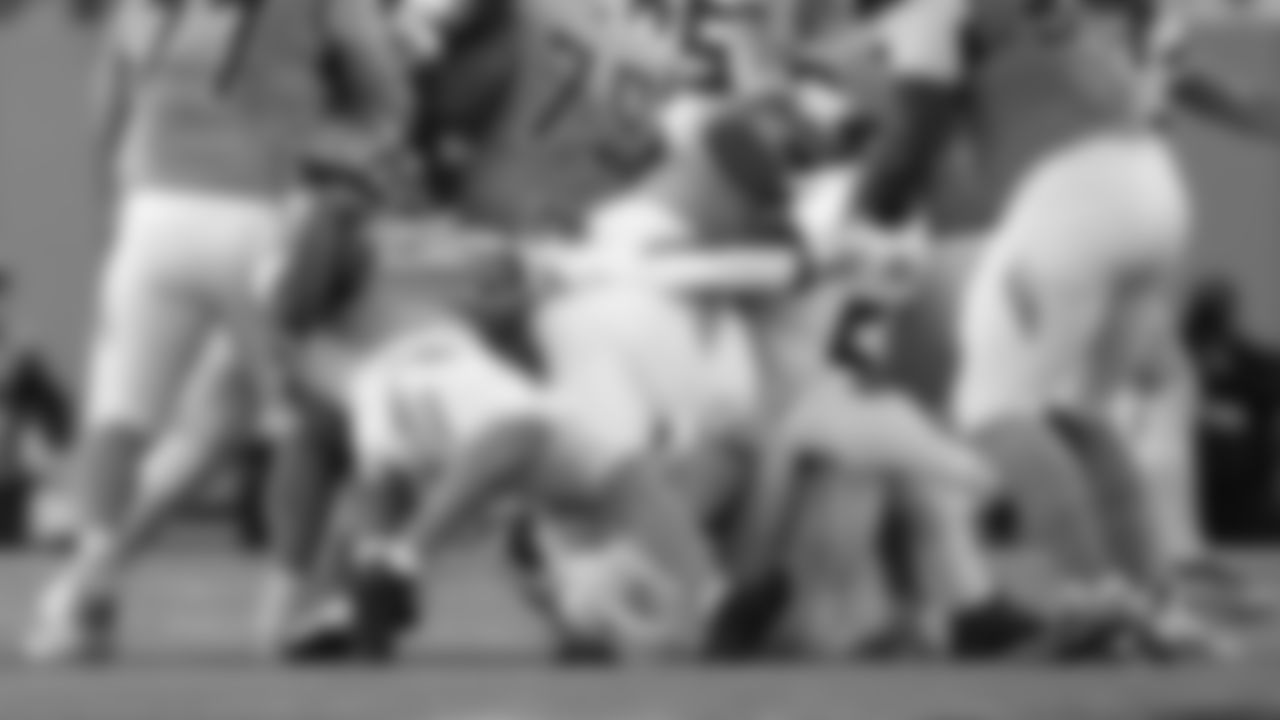 Seahawks linebacker Derick Hall makes an incredible one-handed sack while being blocked.