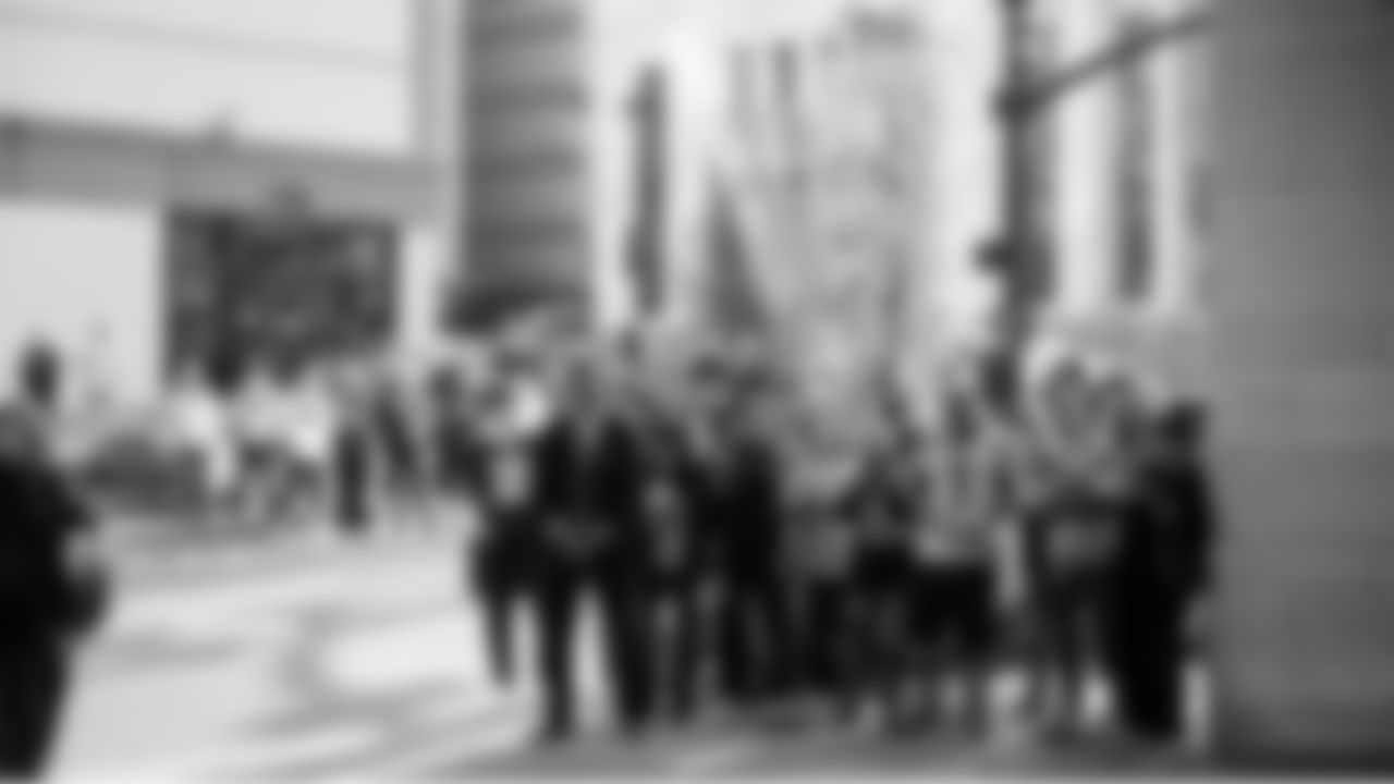 12s wait outside the team's hotel in Nashville to watch the Seahawks board their buses for the game.