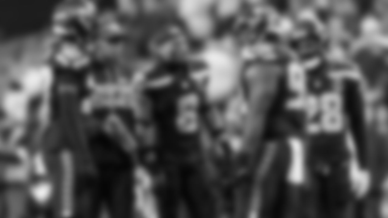 During a time out in the fourth quarter, members of Seattle defense confer. From left are Riq Woolen, head athletic trainer David Stricklin, Coby Bryant, Jarran Reed and Nehemiah Pritchett.