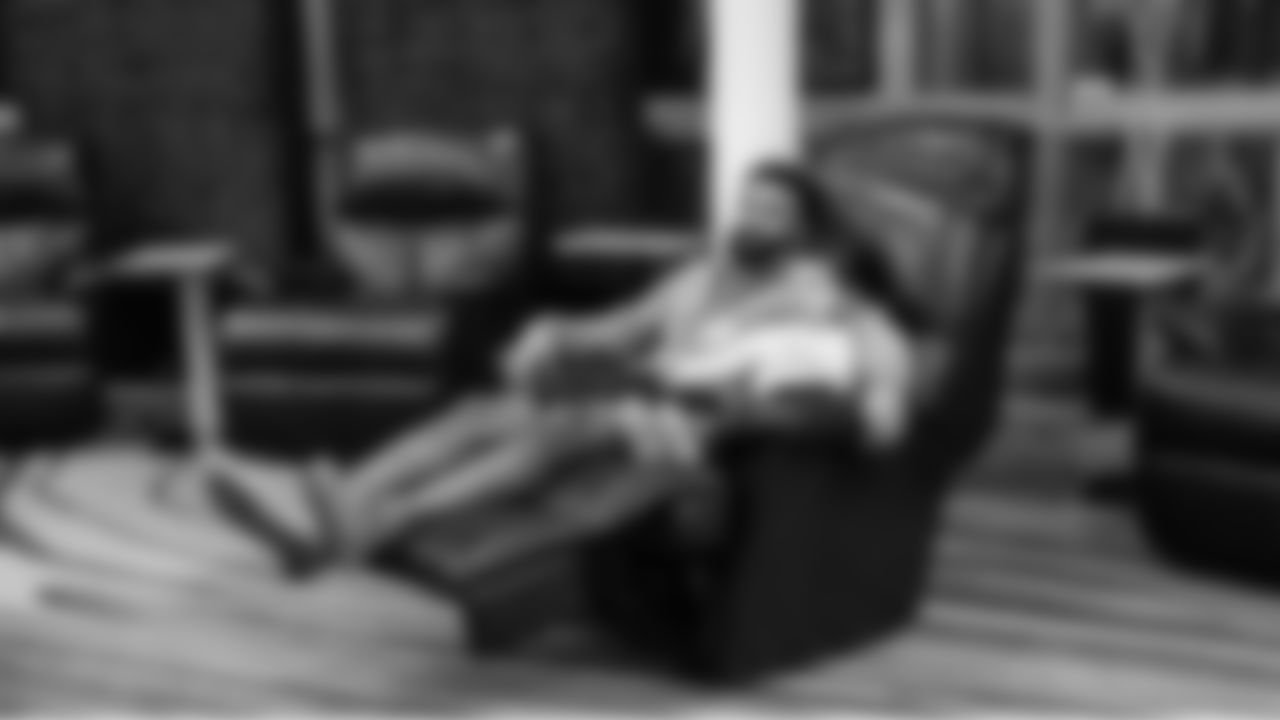 On the night before the game, Seahawks safety Julian Love and his son relaxed in a recliner at the team hotel.