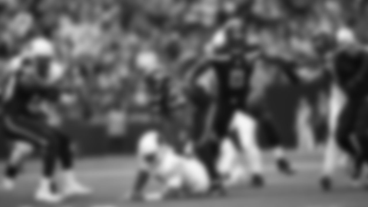 Seahawks linebacker Tyrice Knight (48) sacks Cardinals QB Jacoby Brissett and defensive end DeMarcus Lawrence (0) scoops the ball up and scores the touchdown.