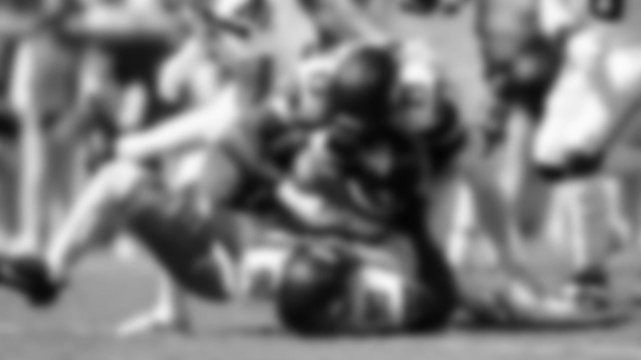 Seahawks Jarran Reed and Ernest Jones IV sandwich Jags running back Travis Etienne.