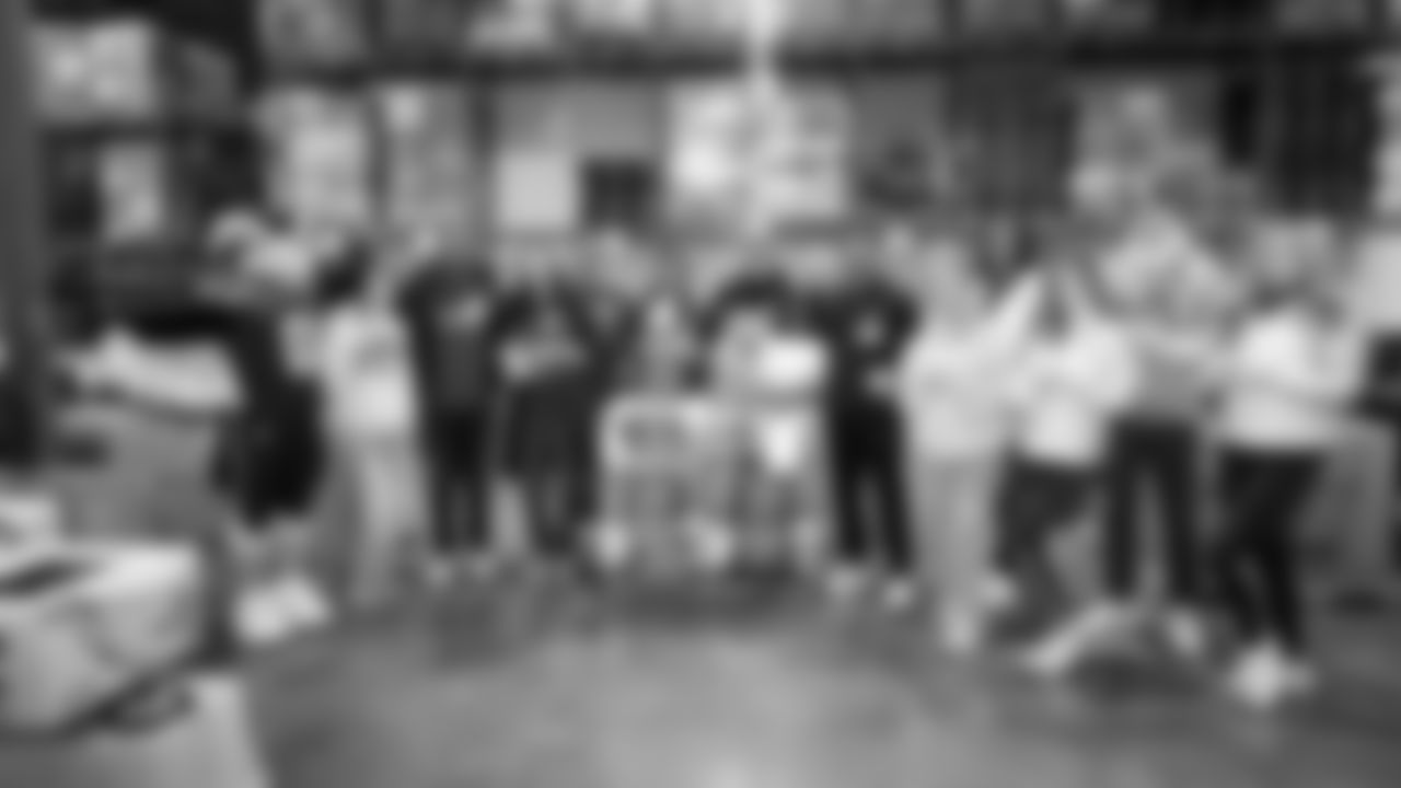 Seahawks Legend Bryan Walters, Dancers, Blitz and volunteers helped sort 4,800 pounds of action green apples at the Food Lifeline distribution center on January 22, 2026.