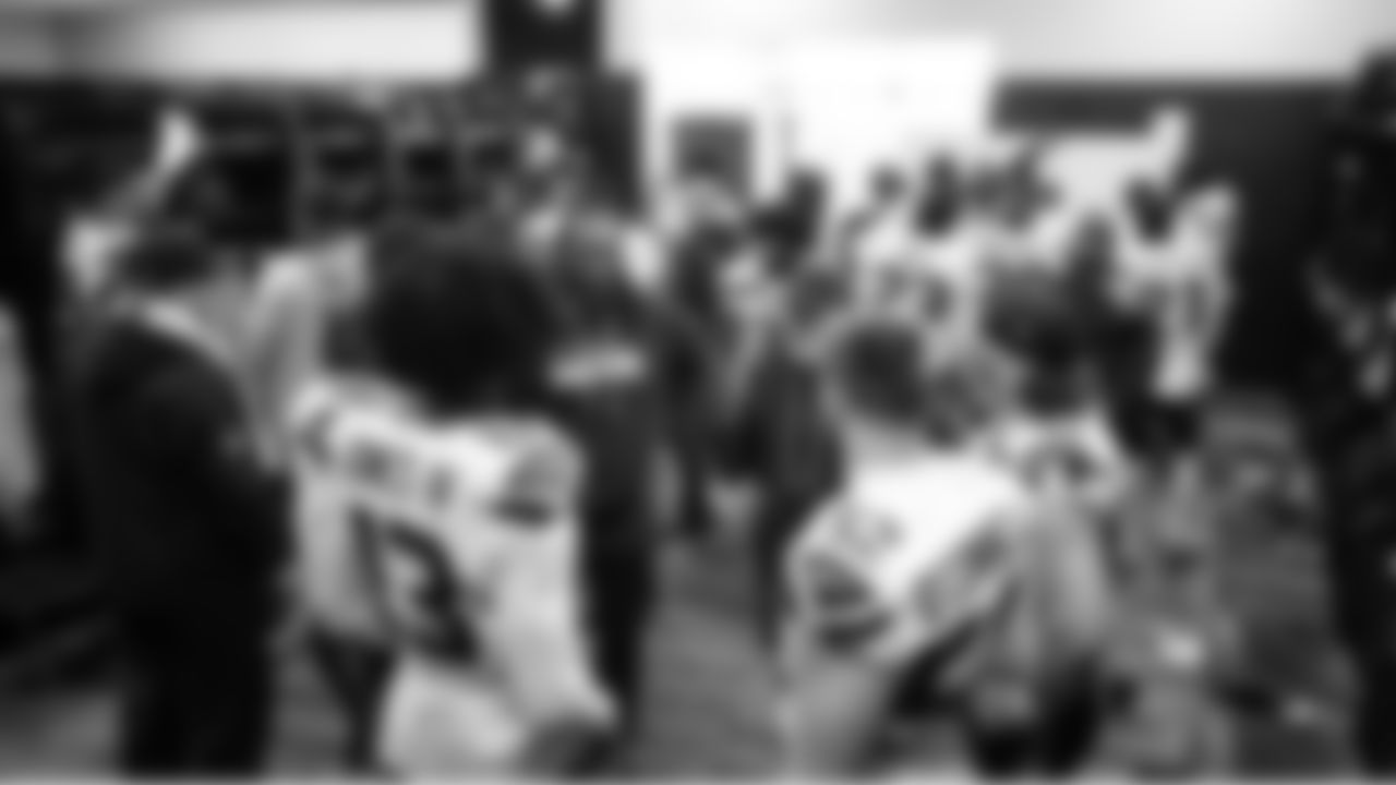 Seahawks defensive position groups meet in the locker room at halftime.