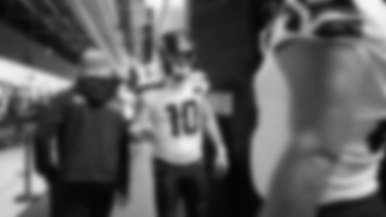 Seahawks wide receiver Cooper Kupp greets players as they leave the locker room and head to the field for kickoff.