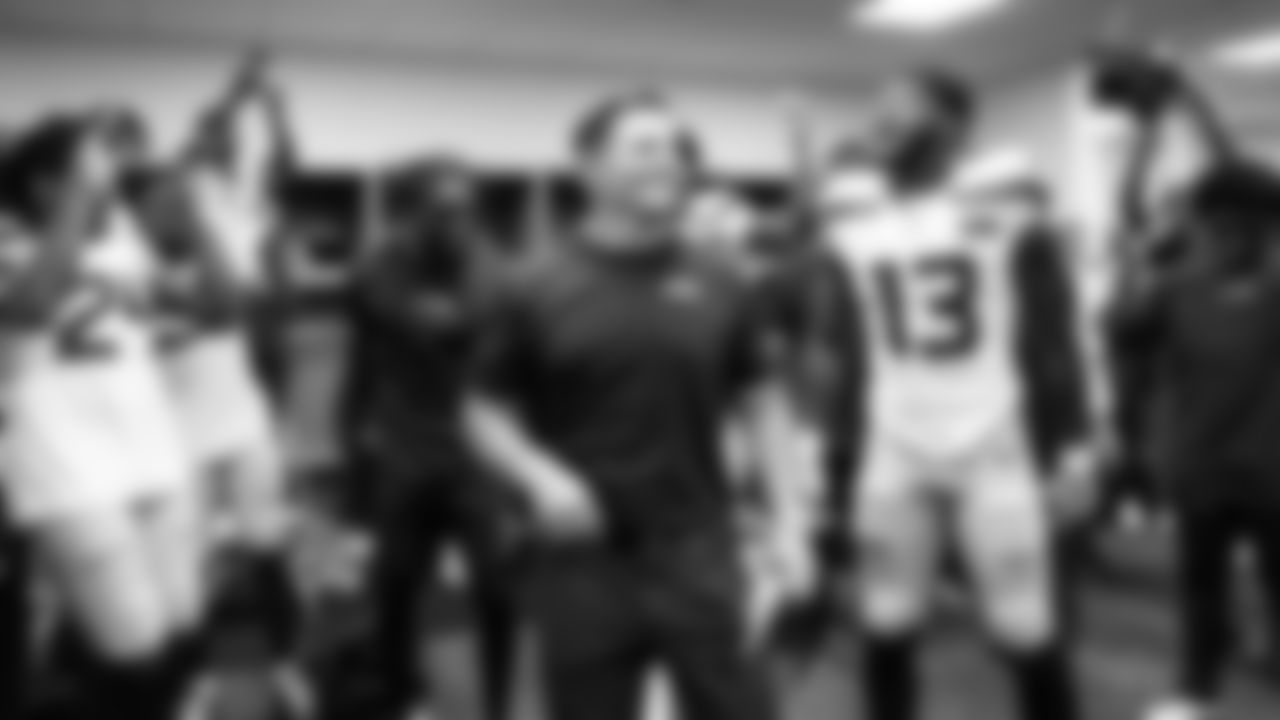 The Seahawks, with head coach Mike Macdonald, celebrate the victory in the locker room after the game.