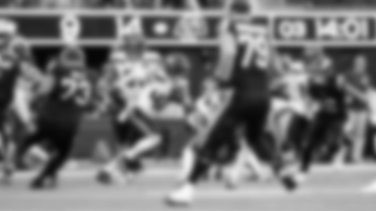 Seahawks linebacker Drake Thomas returns a fumble recovery on a ball knocked loose by teammate Coby Bryant in the third quarter.