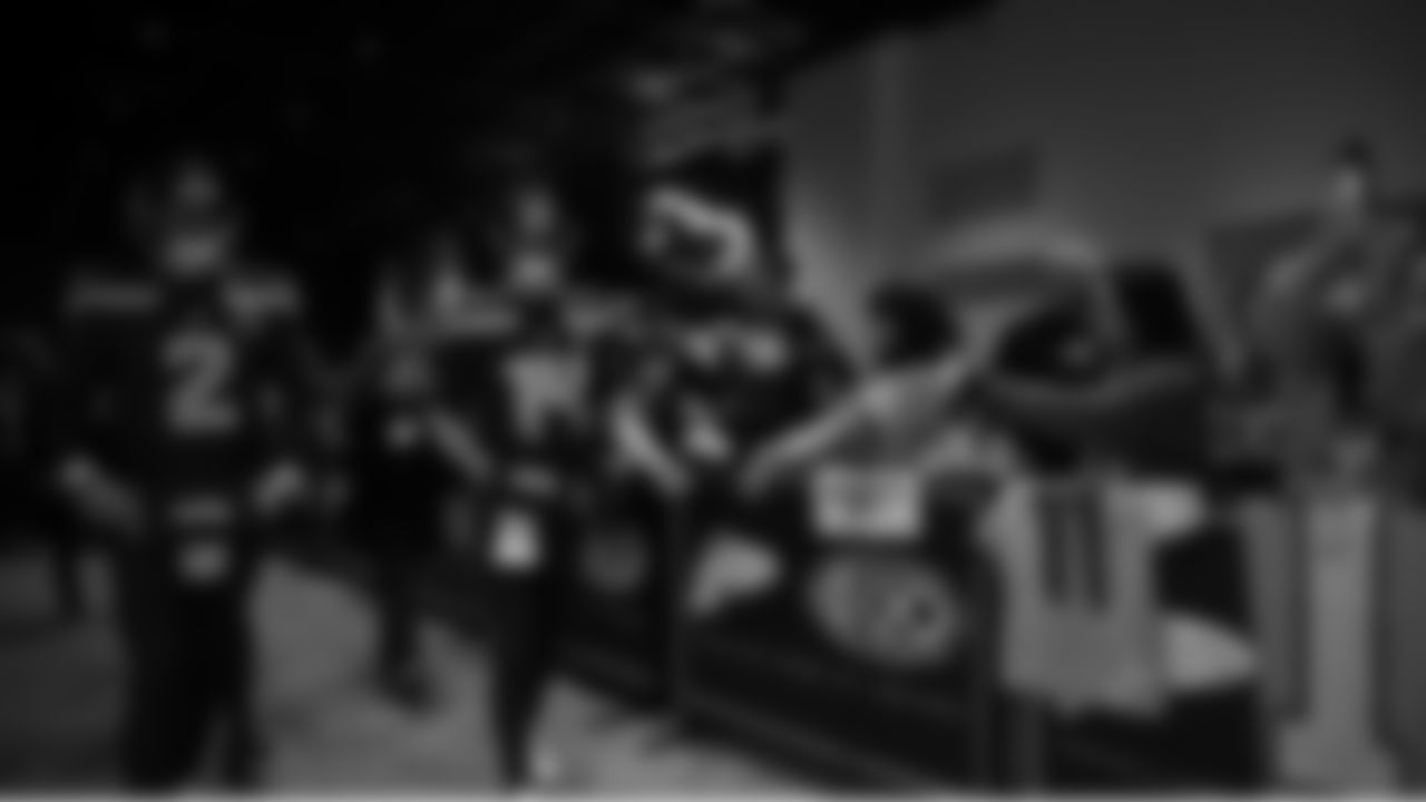 Seahawks quarterback Drew Lock (2) and quarterback Sam Darnold (14) walks through the Emerald Queen Casino tunnel club at Lumen Field for the Week 15 matchup vs. the Colts.