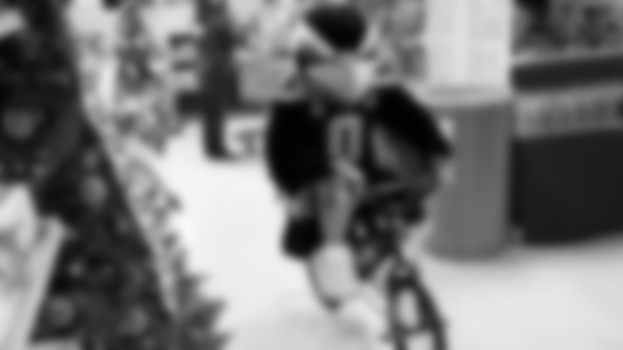 Seahawks Fullback Brady Russell, the Seahawks Dancers, and Blitz spent the day volunteering at Santa's Castle on Joint Base Lewis-McChord to celebrate the holidays and support service members and their families.