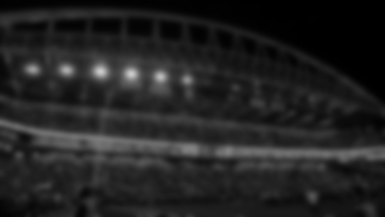 Lumen Field is awash in lights from mobile phones during a time out.