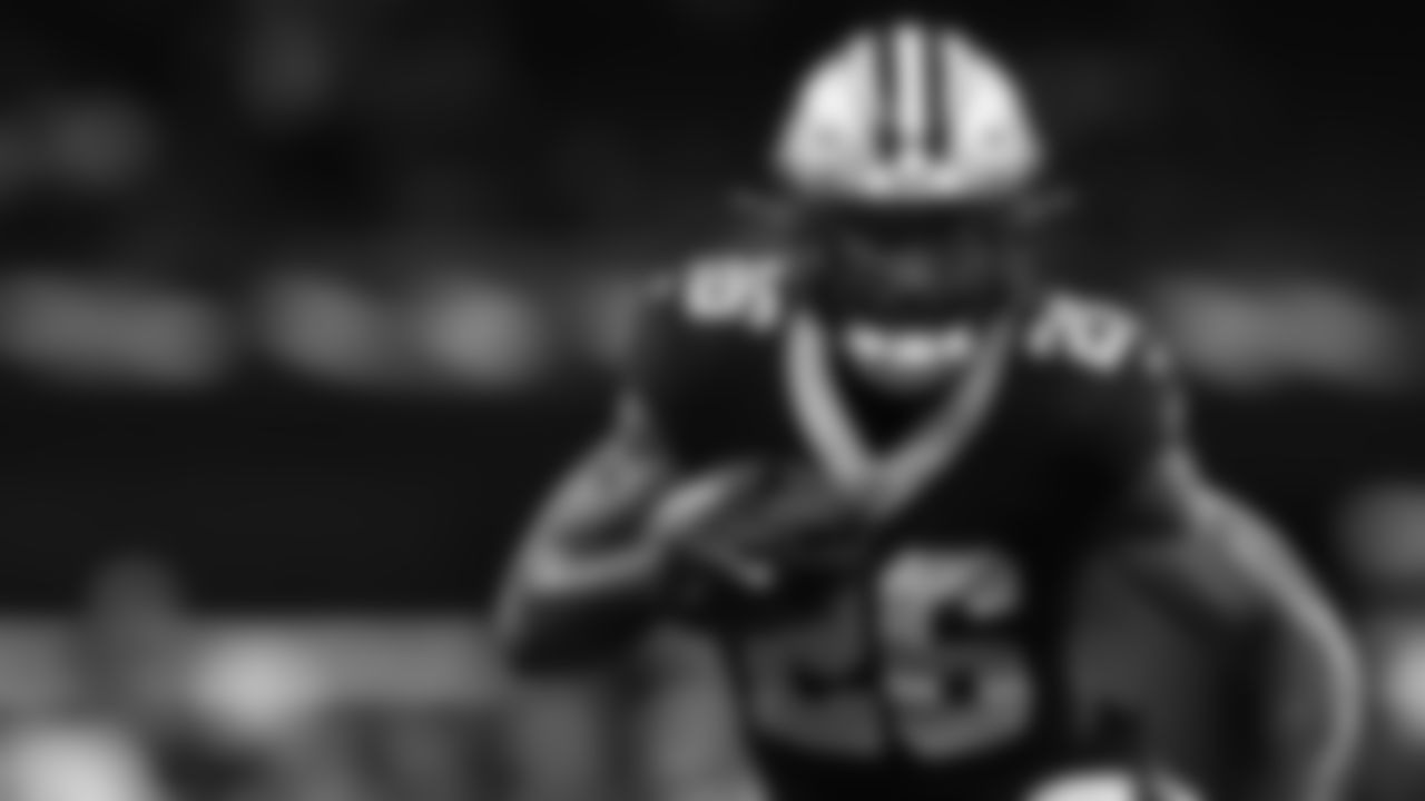 New Orleans Saints running back Cam Akers (26) carries the ball on a running play during an NFL preseason football game against the Jacksonville Jaguars, Sunday, Aug. 17, 2025, in New Orleans. (Aaron M. Sprecher via AP)