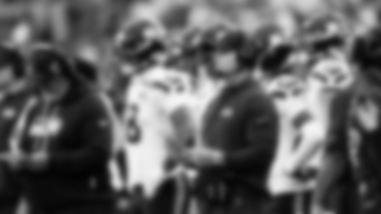 Head coach Mike Macdonald surveys the field from the sidelines.