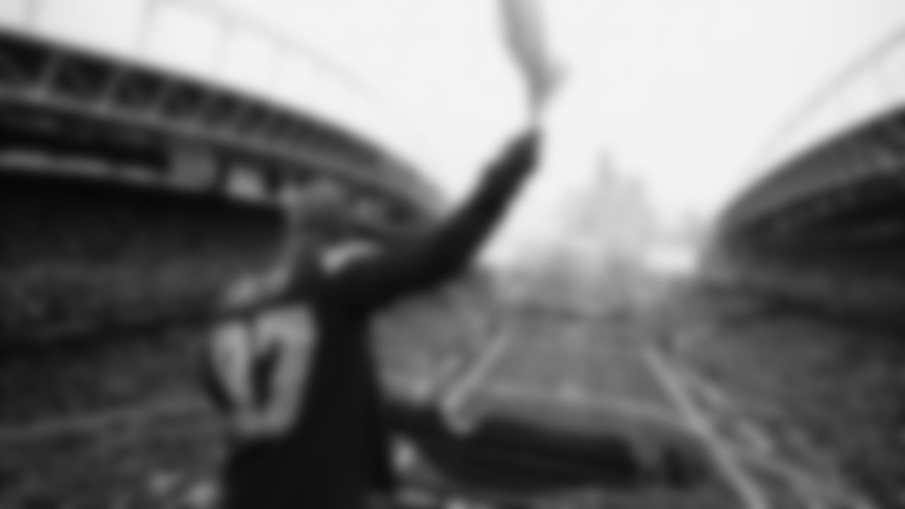 Seahawks Legends Rufus Porter and John L. Williams raise 12 flag in week 15 on December 14, 2025